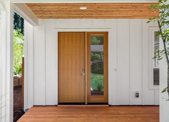 Porte d'entrée en bois pour villa moderne